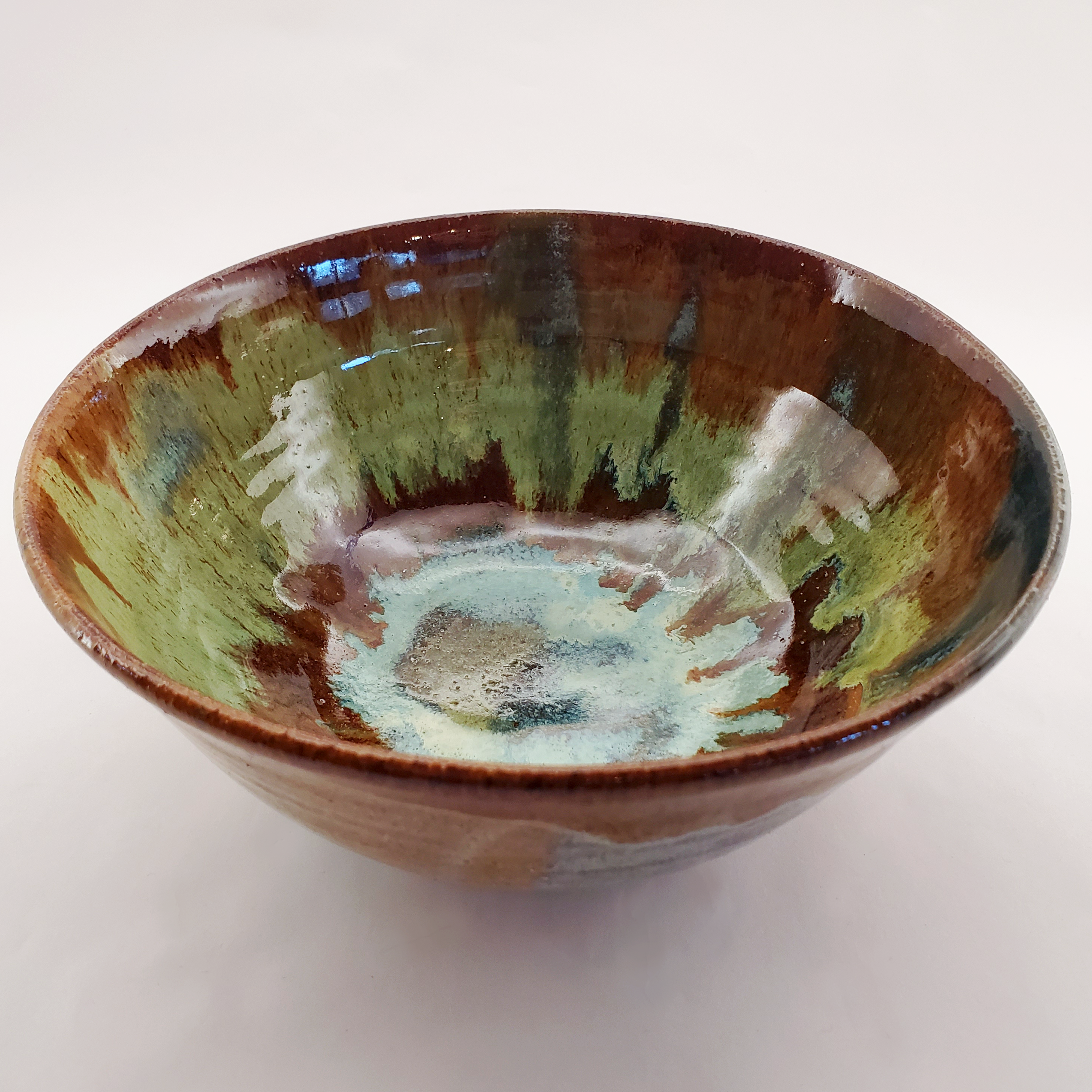 Beautiful Feathered style bowl glazed in greens and browns. Handmade on Vashon Island by Abraham McBride Pottery. Local ceramics artist, Seattle Washington. Small business, Made in the USA. 