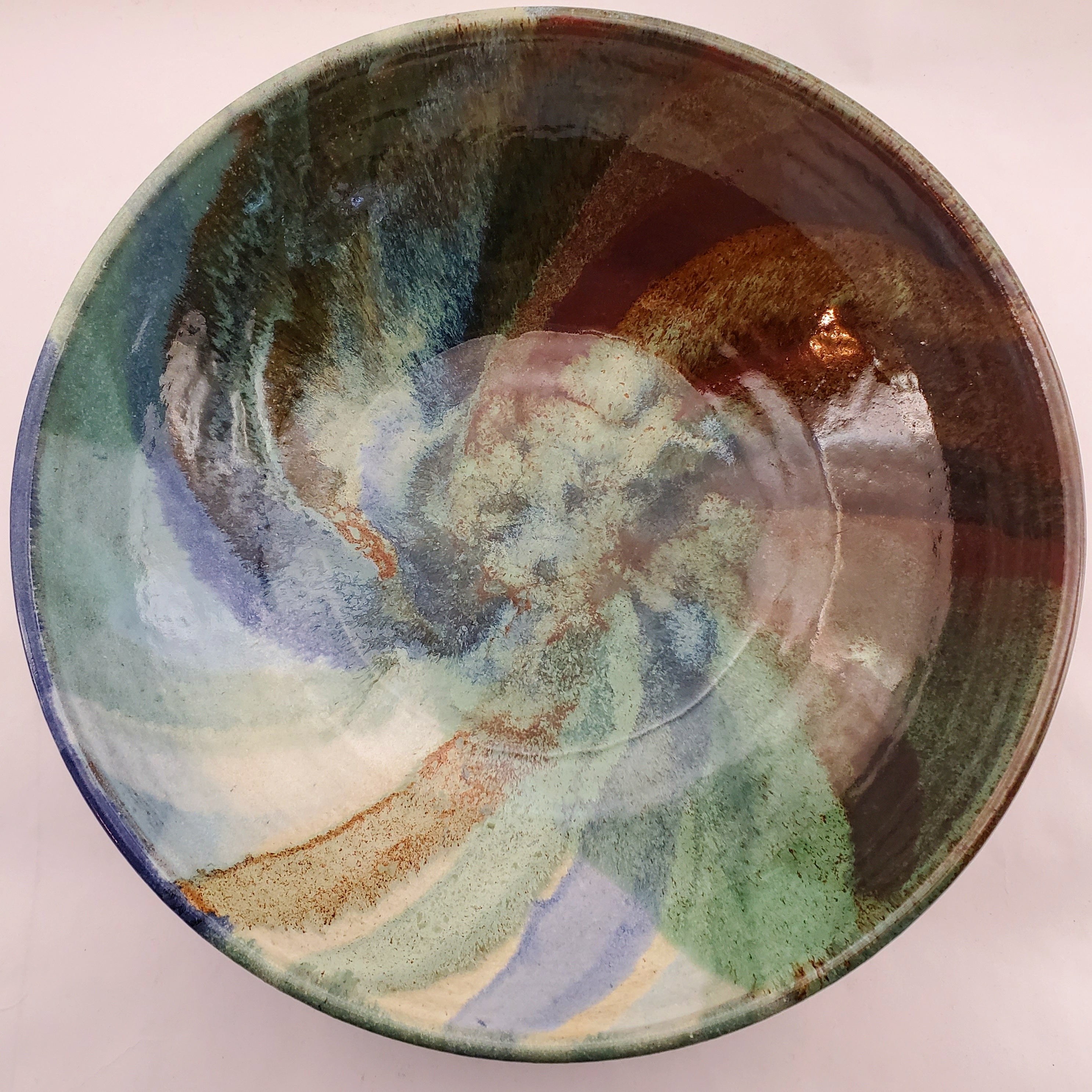 Beautiful, Signature style bowl glazed in blues, greens and browns. Handmade on Vashon Island by Abraham McBride Pottery. Local ceramics artist, Seattle Washington. Small business, Made in the USA. 